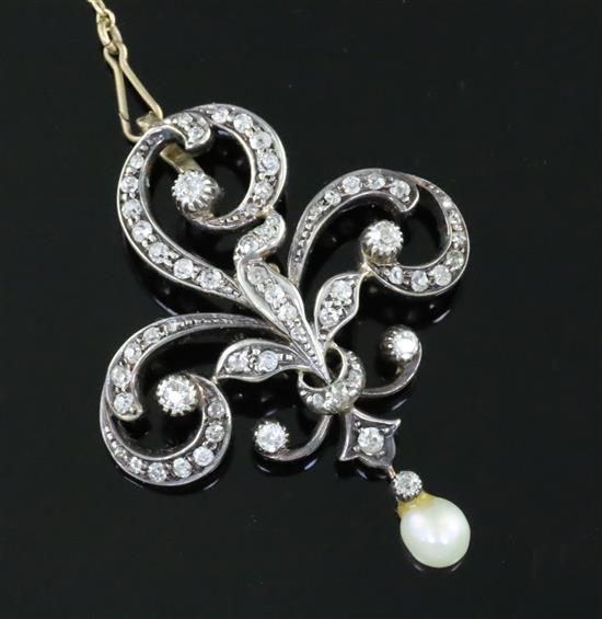 A late Victorian gold and silver, diamond and drop pearl set openwork scroll pendant brooch, gross weight 8.9 grams.